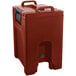 A red plastic Cambro soup carrier with a handle.
