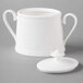 A Villeroy & Boch white bone porcelain sugar bowl with a lid.