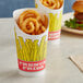 A container of Choice paper scoop cups with a fry design filled with french fries.