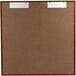 A brown board with metal clips and a white background.