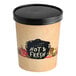 A Choice paper soup cup with a black vented paper lid on a counter.