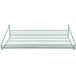 A green wire rack and shelf on a green metal grid.