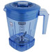 A blue Waring blender jar with a handle and a lid.