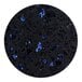 A black circle with blue and black speckled Art Marble Furniture Blue Galaxy Quartz Tabletop.