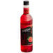 A close up of a DaVinci Gourmet Classic Strawberry Flavoring syrup bottle filled with red liquid.