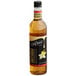 A close up of a DaVinci Gourmet Classic French Vanilla Flavoring Syrup bottle with a white label.
