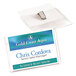 A clear horizontal name tag holder with a clip holding a business card with the name Chris Corvoda.