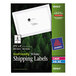 A package of white rectangular Avery shipping labels.
