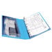 A blue Avery Protect and Store mini binder with a white piece of paper inside.