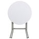 A Flash Furniture round white plastic folding table on metal legs.