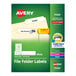 A package of white Avery file folder labels with white labels on a green and white file folder.