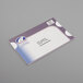 A white envelope with a white round Avery seal with a blue and purple logo.