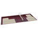 An Avery maroon heavy-duty binder with 2" locking One Touch EZD rings holding a piece of paper.