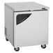 A stainless steel Turbo Air undercounter refrigerator with a black door.