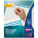A hand holding a clear plastic label with white background for Avery Index Maker plastic dividers.
