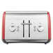 A silver and red KitchenAid four slice toaster on a counter.