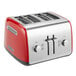 A red and silver KitchenAid four slice toaster with manual lift.