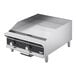 A stainless steel Vollrath countertop griddle with black and silver manual controls.