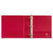 A red binder with white metal rings.