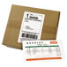 A cardboard box of white Avery rectangular shipping labels with paper receipts inside.