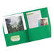 A green Avery paper folder with papers and a picture inside.