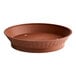 A brown plastic round diner platter with a base.
