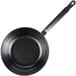A black cast iron skillet with a handle.
