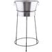 A Tablecraft brushed stainless steel beverage tub on a black metal stand.