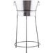 A Tablecraft brushed stainless steel beverage tub on a black metal stand.