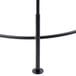 A black metal pole with a round base.