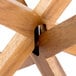 A wooden table with three wooden risers on it.