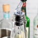 A close-up of a Tablecraft clear plastic measured liquor pourer tip.