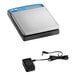 A grey AvaWeigh digital portion scale with a blue screen and a charger.