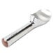 An aluminum Zeroll ice cream scoop with a brown handle.