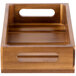 A Tablecraft acacia wood crate with handles on a wood surface.