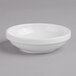 A Villeroy & Boch white porcelain bowl on a gray surface.