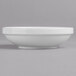 A Villeroy & Boch white porcelain bowl on a gray surface.