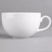 A close-up of a Villeroy & Boch white porcelain cup with a handle.