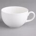 A close-up of a Villeroy & Boch white porcelain cup with a handle.