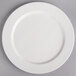 A Villeroy & Boch white porcelain flat plate with a pattern on a white surface.