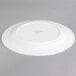 A white Villeroy & Boch porcelain flat plate with a circular design on it.