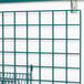 a green grid on a white wall