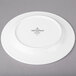 A white porcelain plate with a white rim.