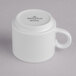 A Villeroy & Boch white porcelain cup with a white handle.