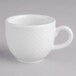 A white porcelain cup with a handle.