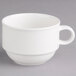 A Villeroy & Boch white porcelain cup with a handle on a gray surface.