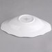 A white Villeroy & Boch porcelain oval deep plate with a scalloped edge.