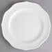 A white Villeroy & Boch porcelain plate with a scalloped edge.