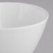 A close-up of a Villeroy & Boch white porcelain gourmet bowl with a white rim.