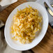 A white Villeroy & Boch porcelain oval dish with macaroni and cheese on it.